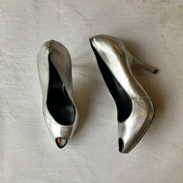 Alexander McQueen silver heels at Manifesto Woman